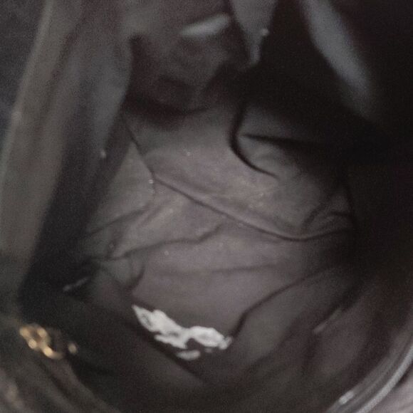 Brown and Black Shoulder Bag with Durable Fabric and Decorative Tassels - Picture 5 of 6